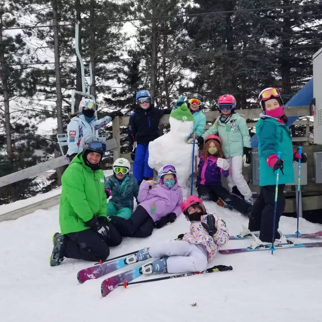 Group of Winter Walden kids with their ski instructor